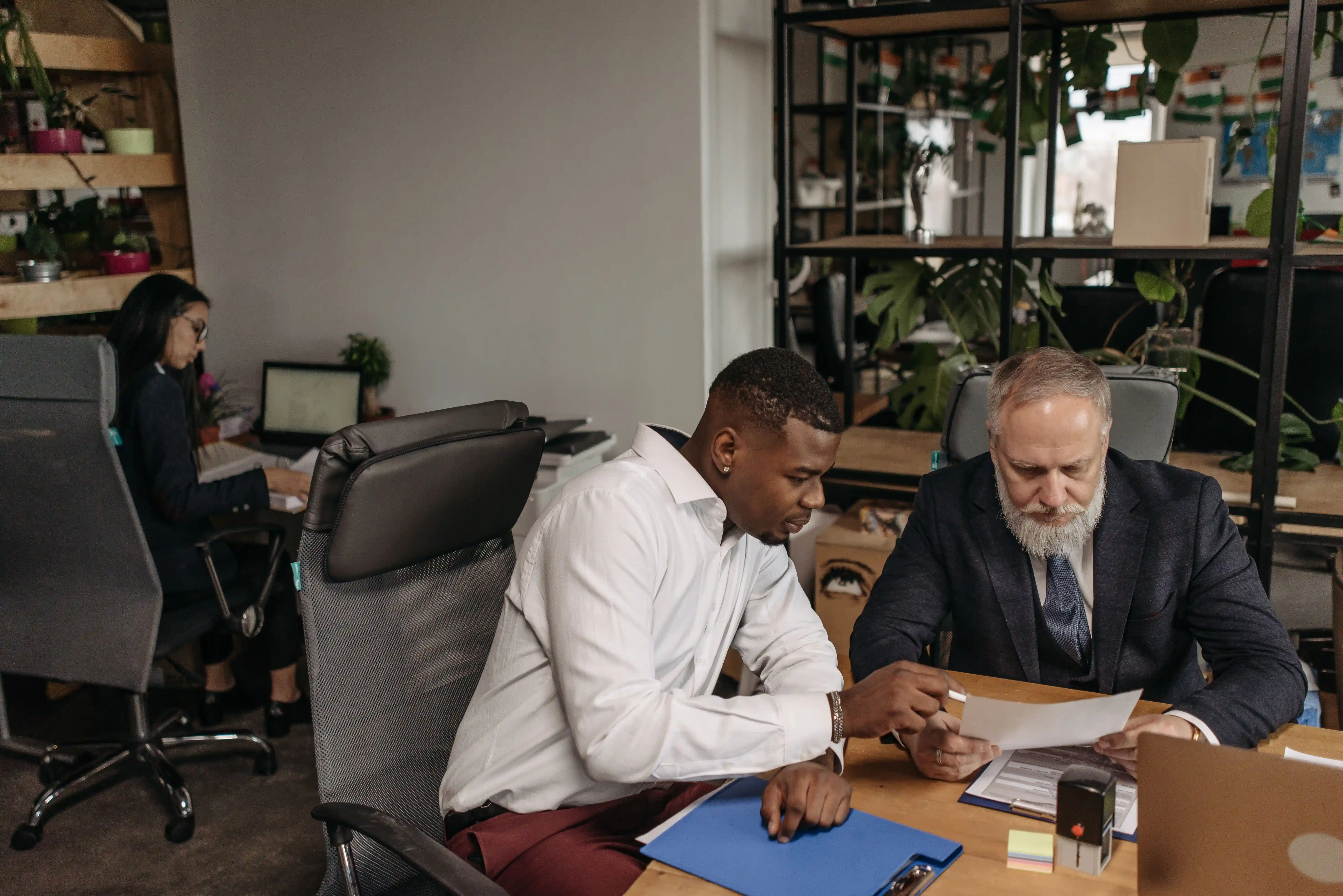 Investment advisors reviewing a balanced portfolio strategy